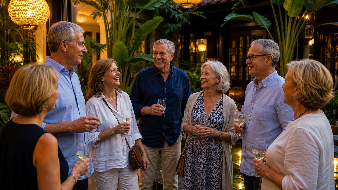 Alumni and affinity travelers gathering in an evening courtyard setting