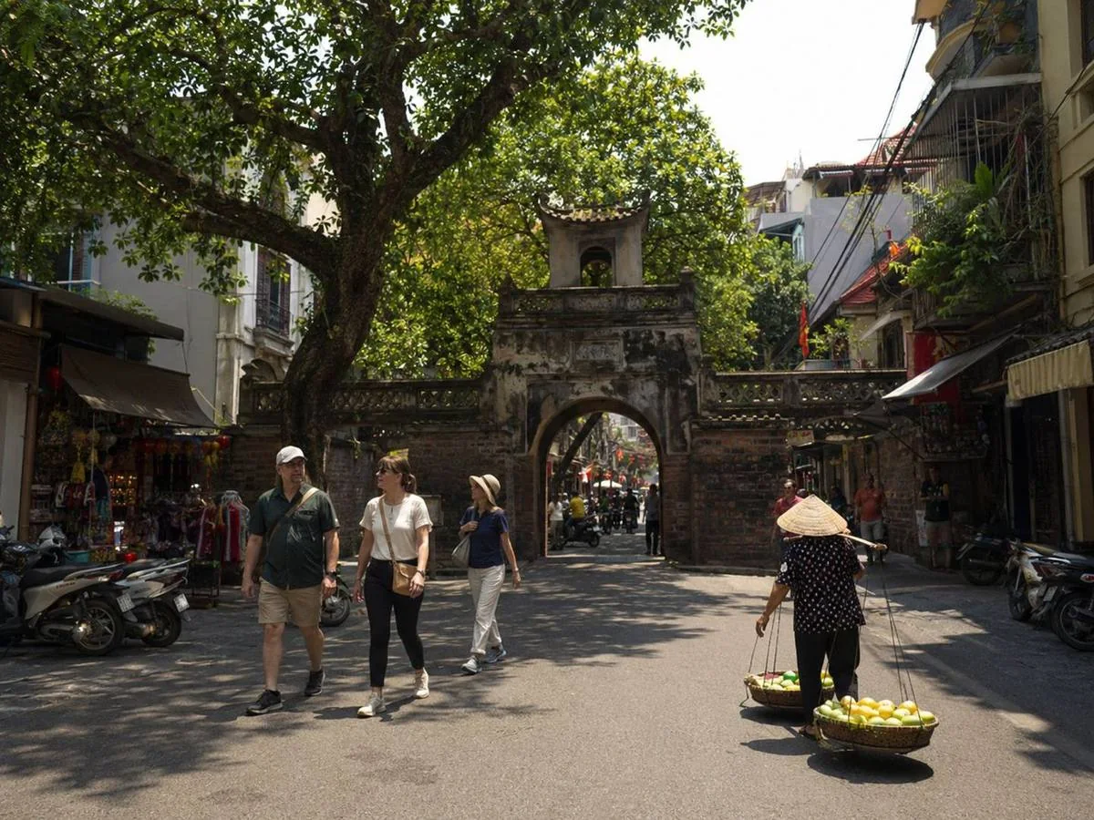 Historic Hanoi street with residents and visitors