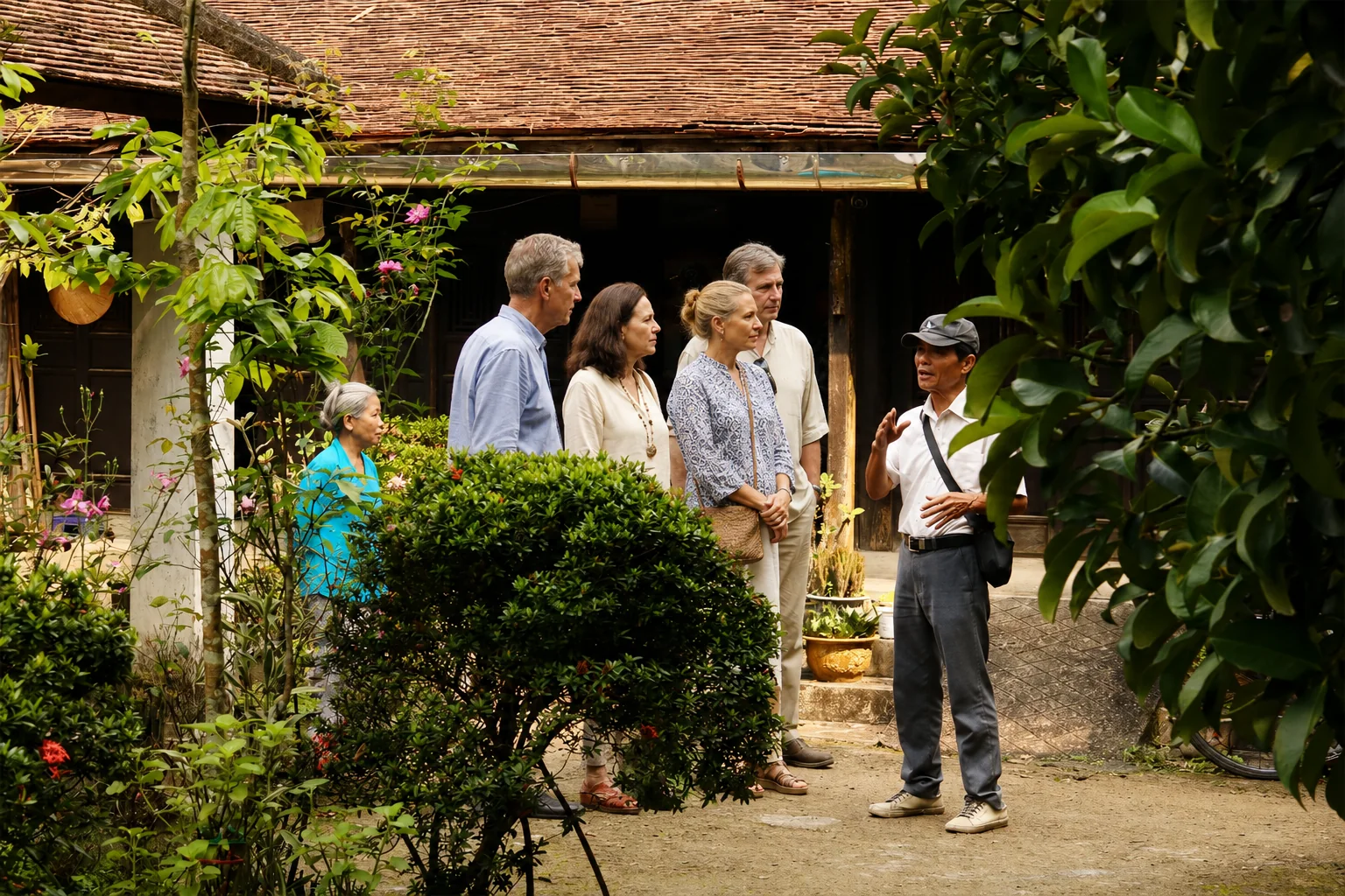 Guests visiting a traditional garden house in Hue